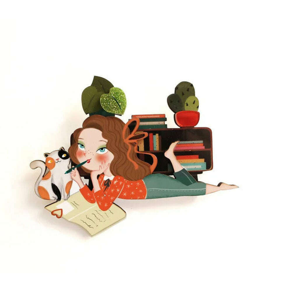 Laliblue diary-themed enamel brooch with girl, books, cat, and green hat