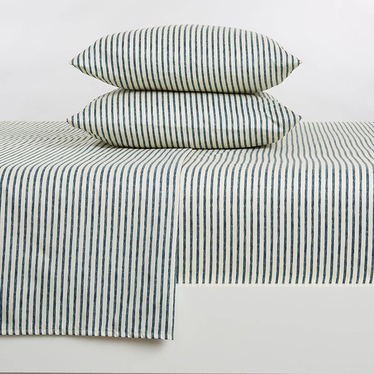 Blue striped microfiber sheet set with folded pillowcases and matching flat sheet