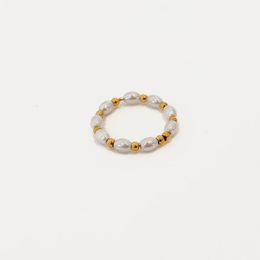 Pearl bead bracelet with gold spacer accents, shown on white
