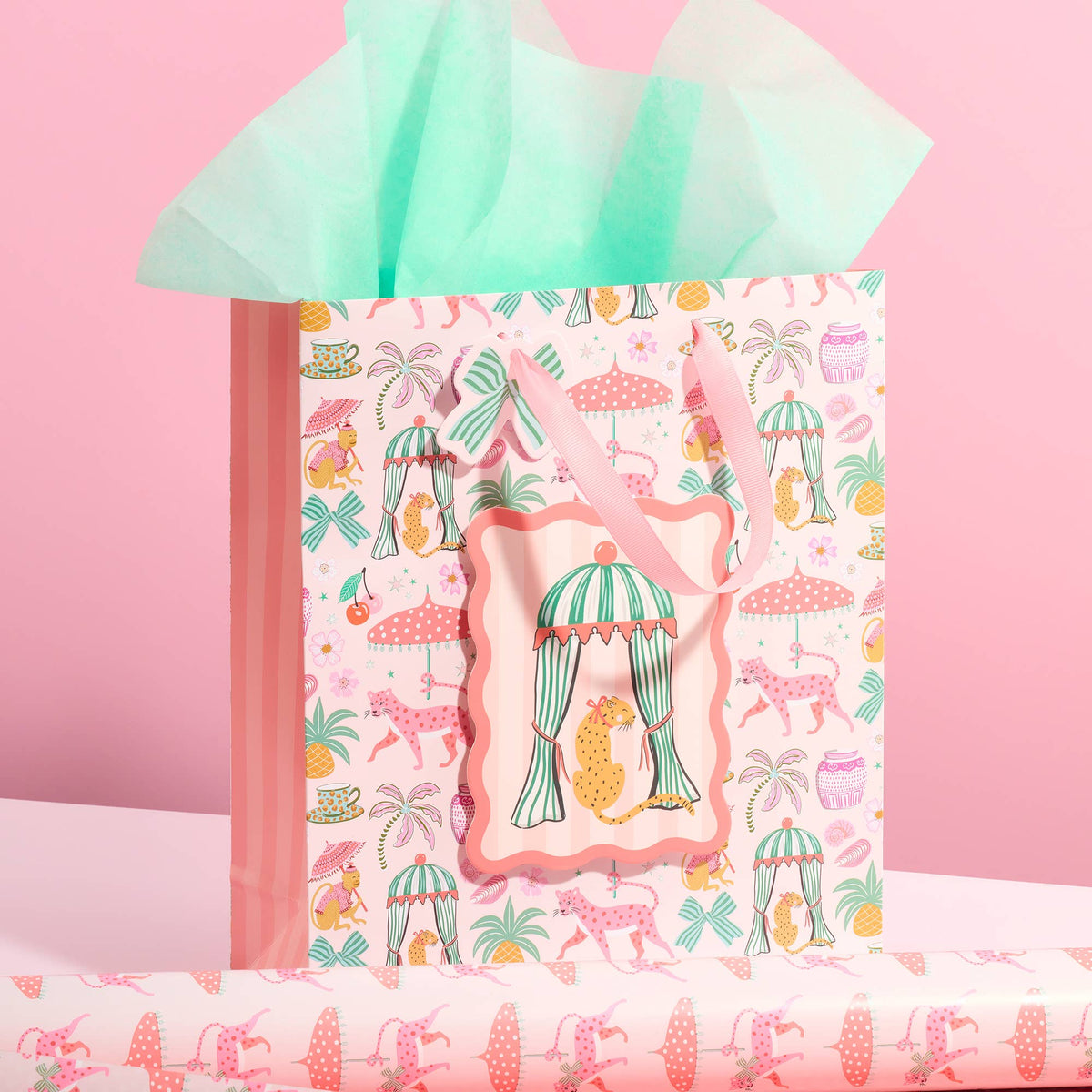 Large gift bag with leopard and umbrella pattern, pink tissue inside