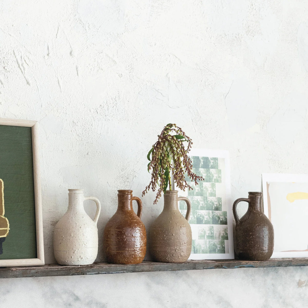 Stoneware jug with rounded body and loop handle, speckled rustic glaze