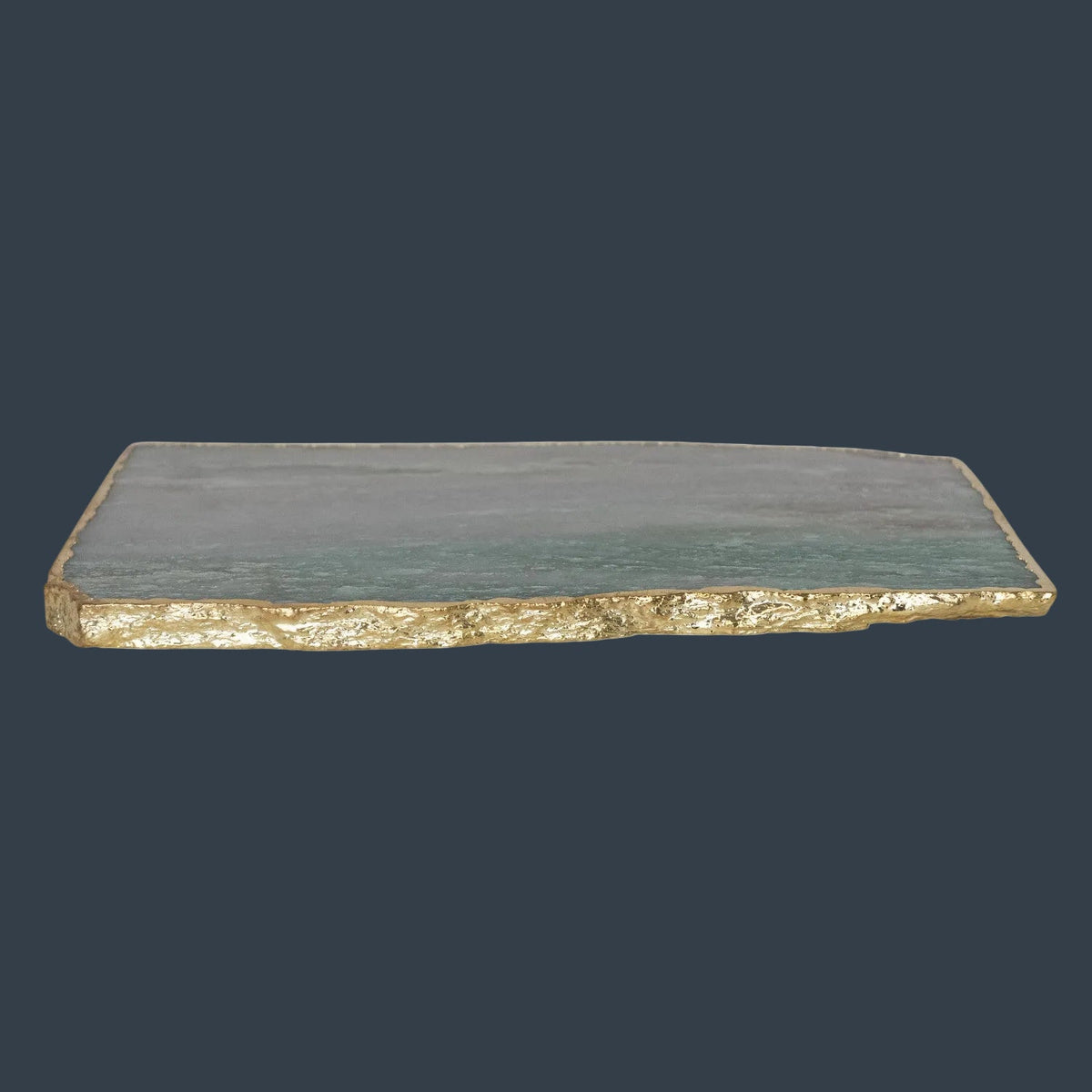Thin blue agate slab with gold electroplated edge, side profile