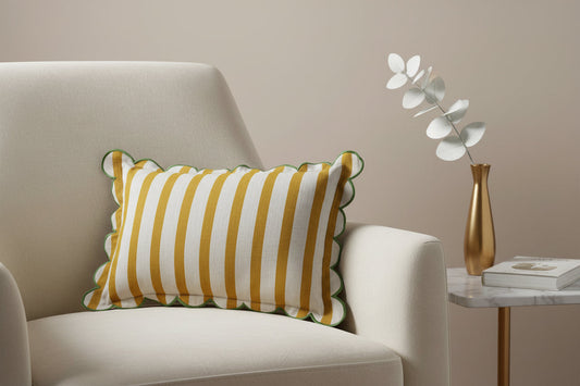 Striped cotton lumbar pillow with scalloped flange, yellow and white stripes