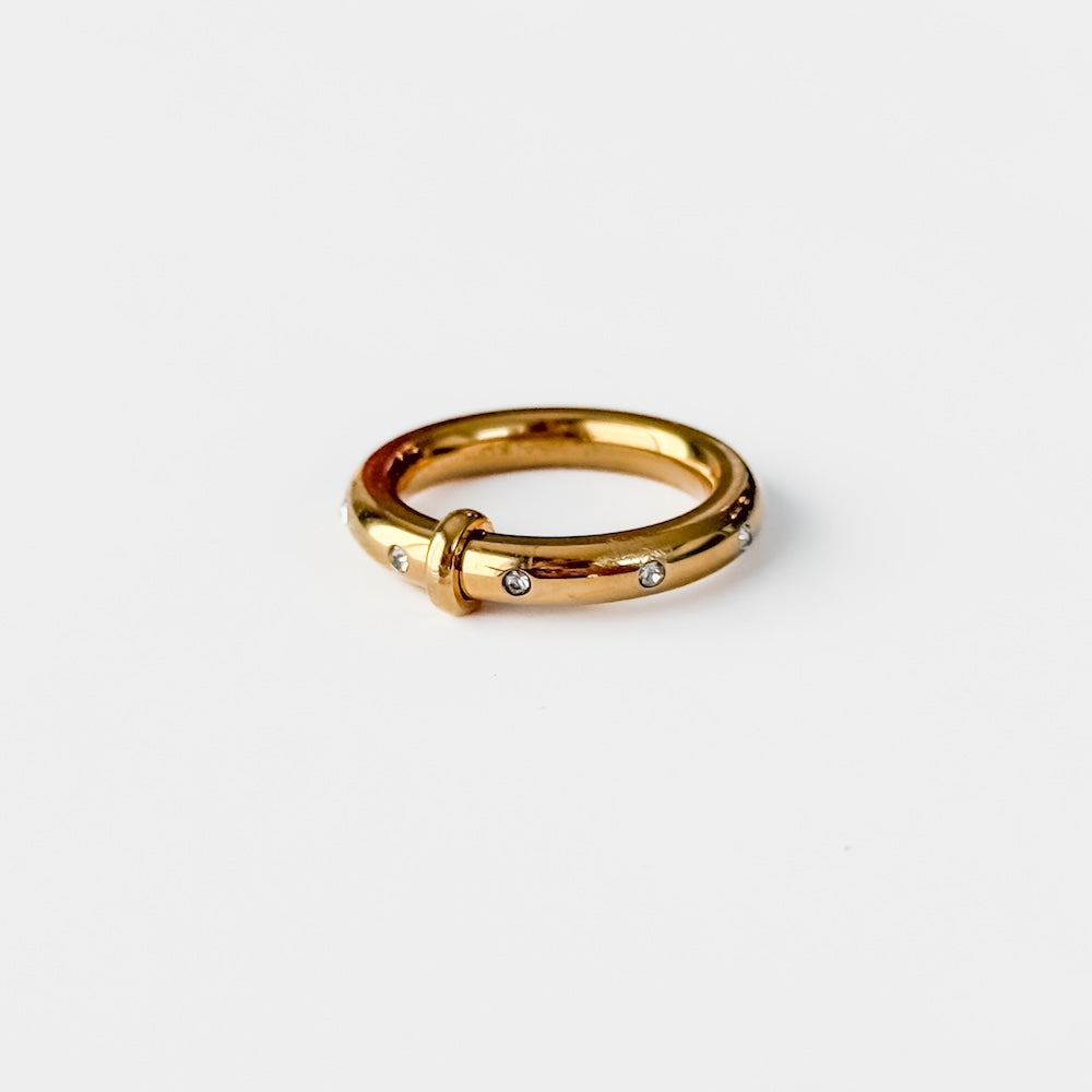 Gold tone diamond-studded band ring with small round stones