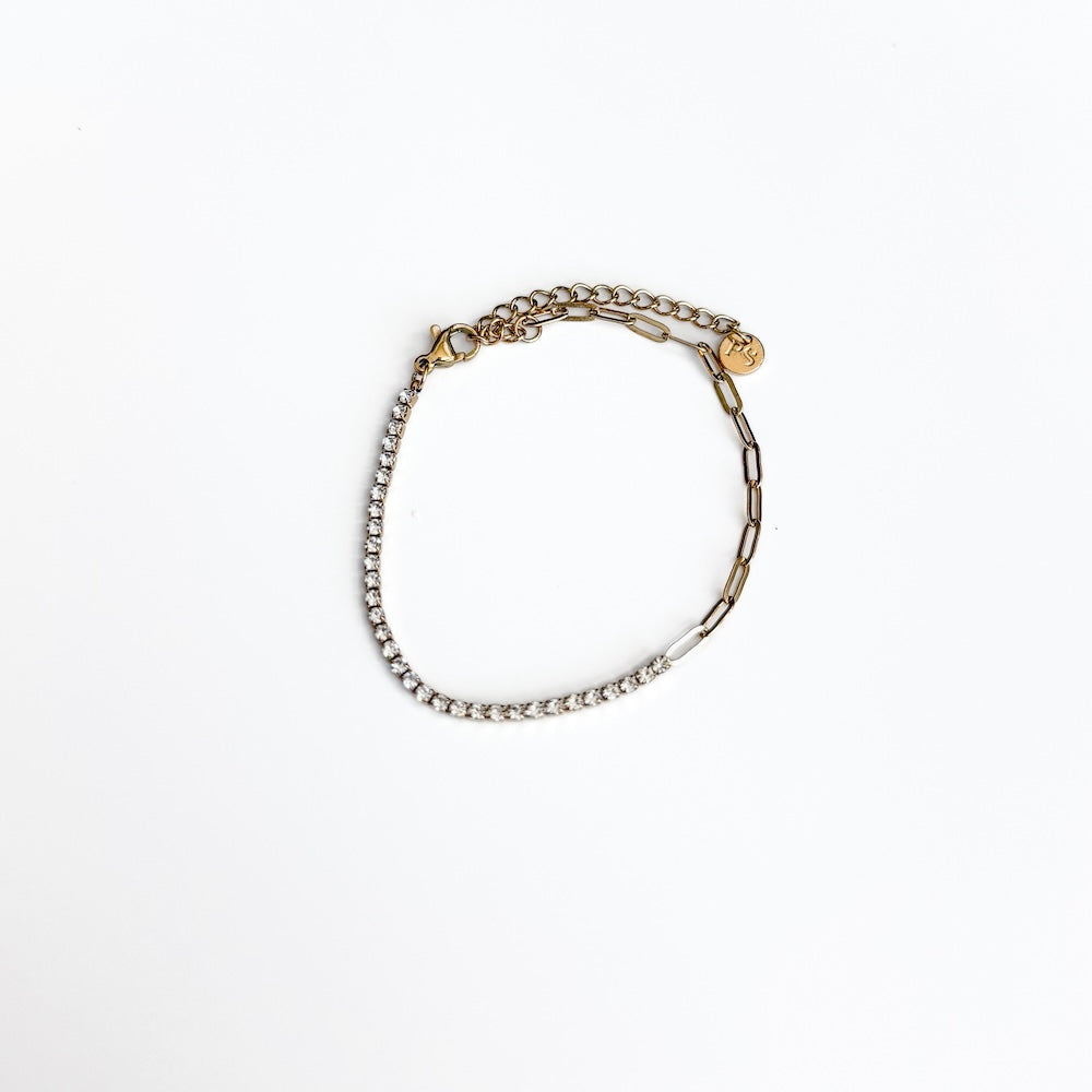 Gold-tone tennis chain bracelet with clear stone row and link chain details