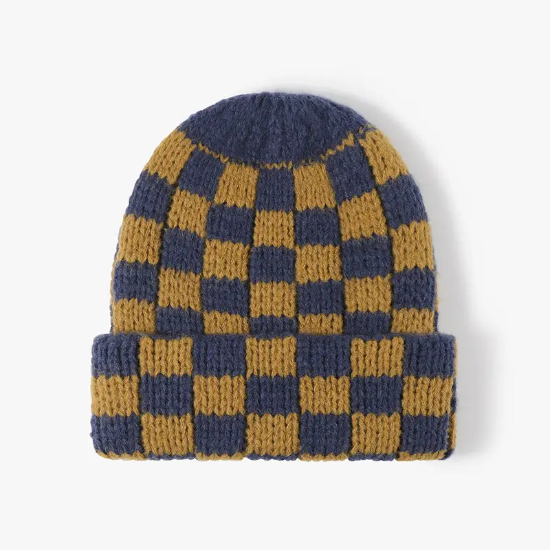 Chunky knitted beanie with a folded cuff and mustard and navy checker pattern