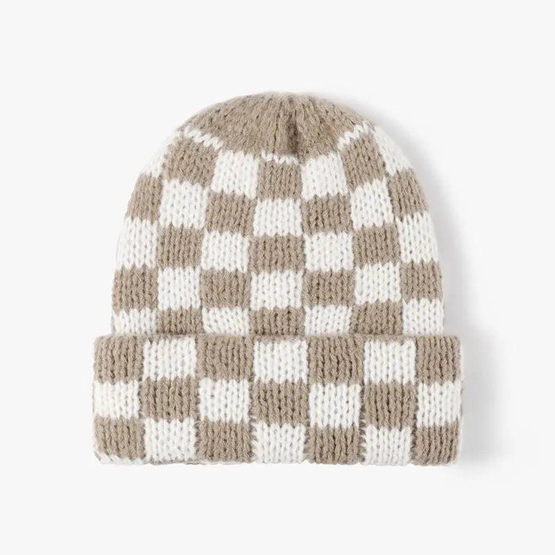 Chunky knitted beanie with a folded cuff and beige and white checker pattern