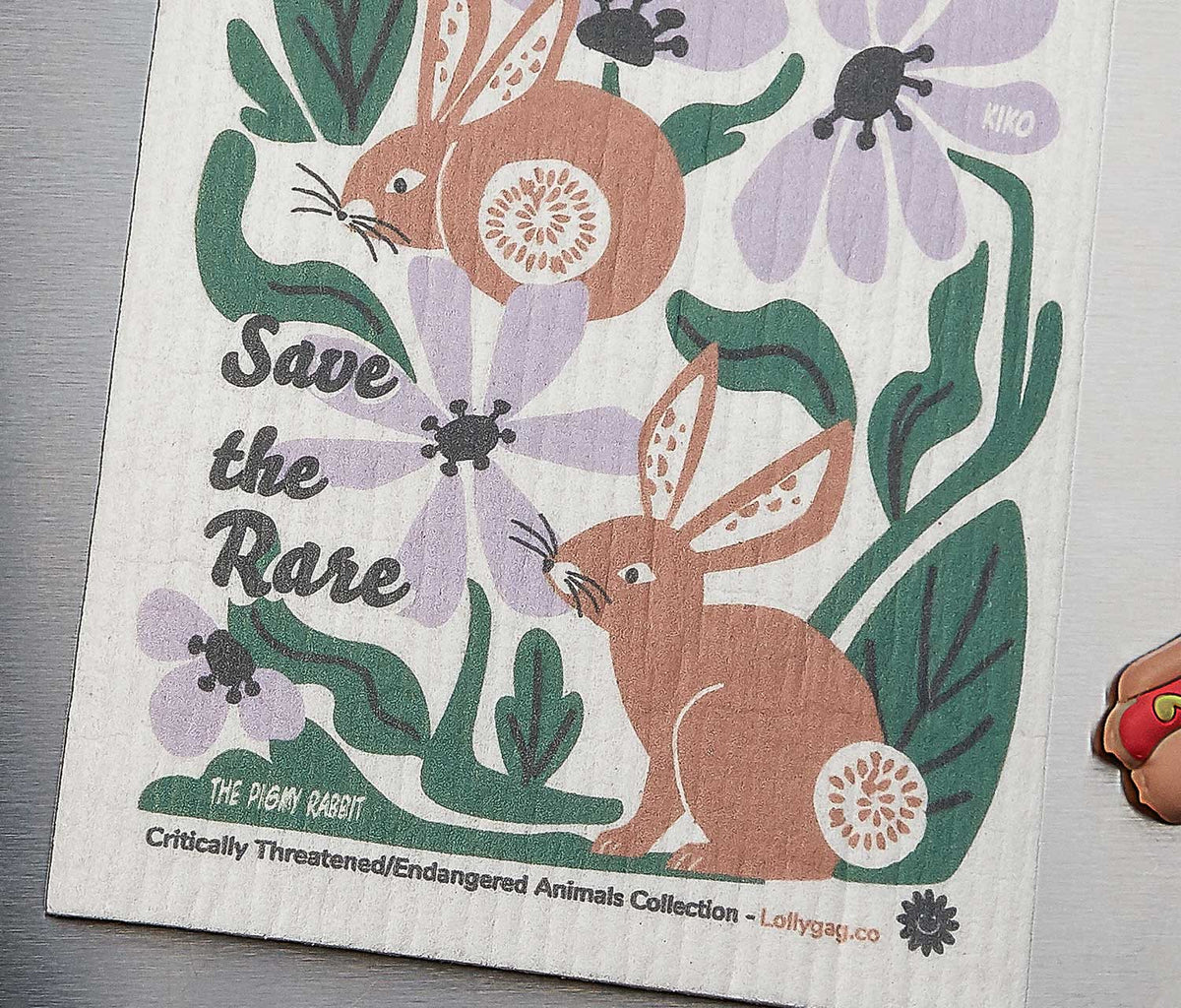 Swedish dishcloth with woodland animal illustration and “Save the Rare” text