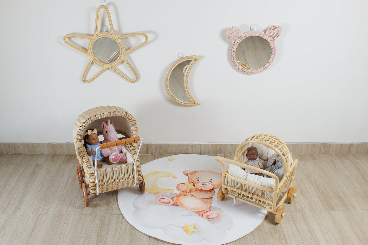 Woven rattan doll prams with curved handles and wooden wheels
