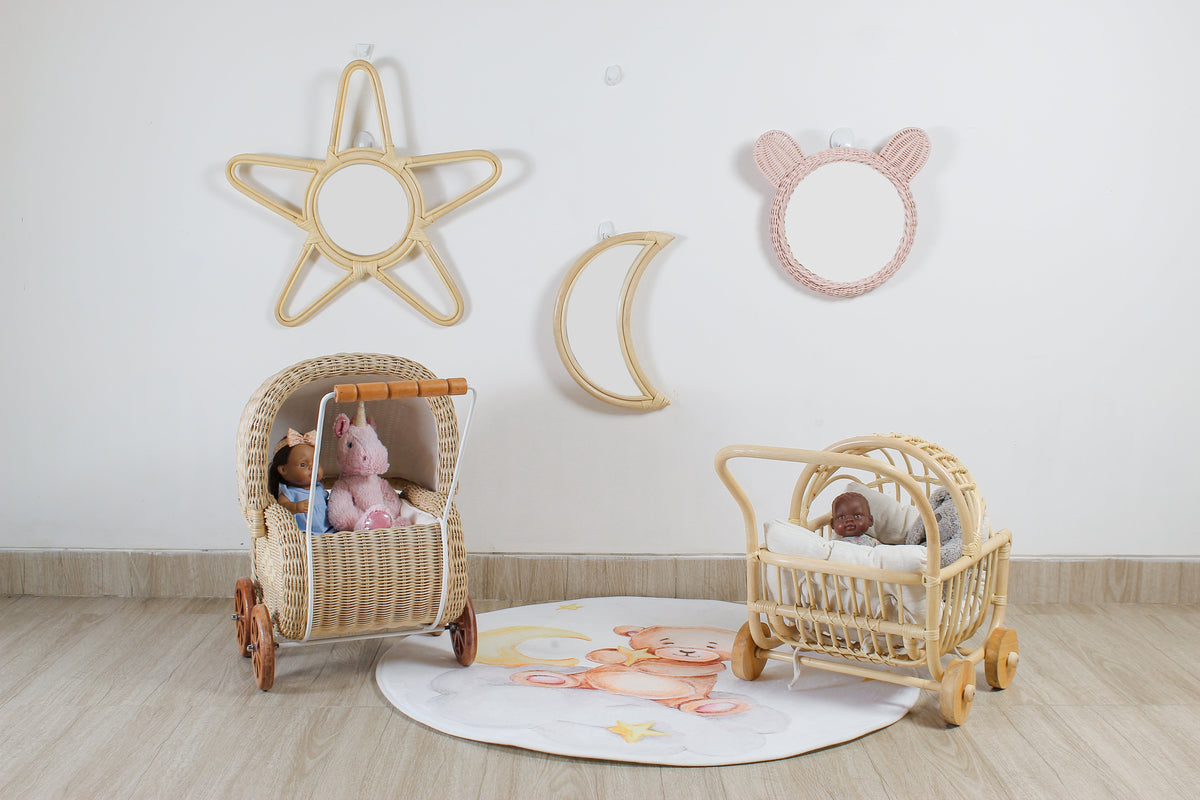 Natural rattan doll strollers with woven bodies, curved handles, and wooden wheels