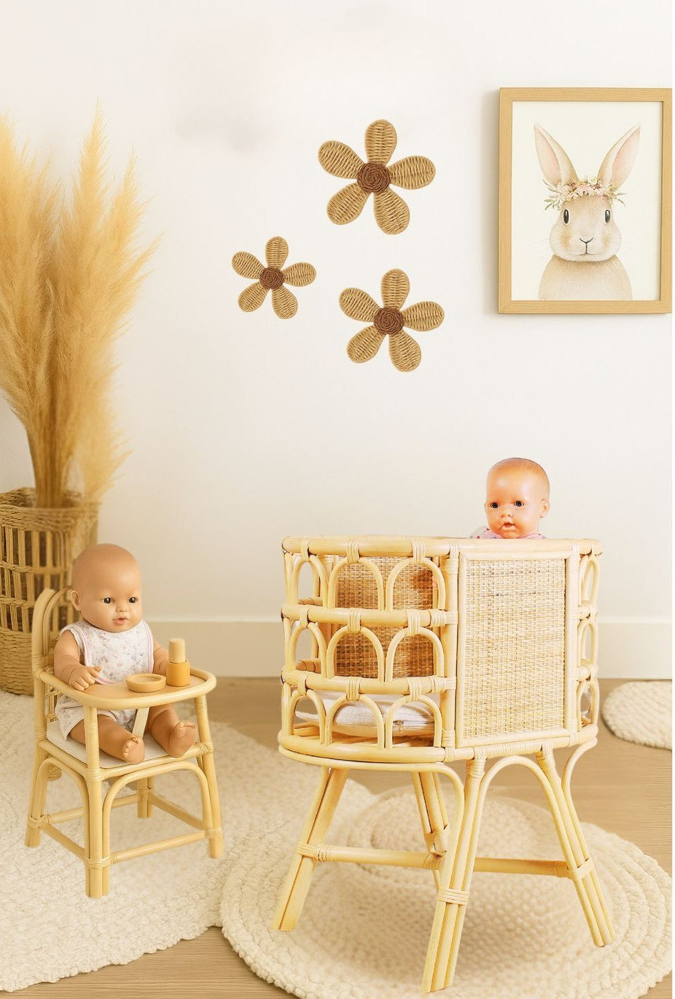 Natural rattan doll crib with raised legs, woven panels, and open arched sides