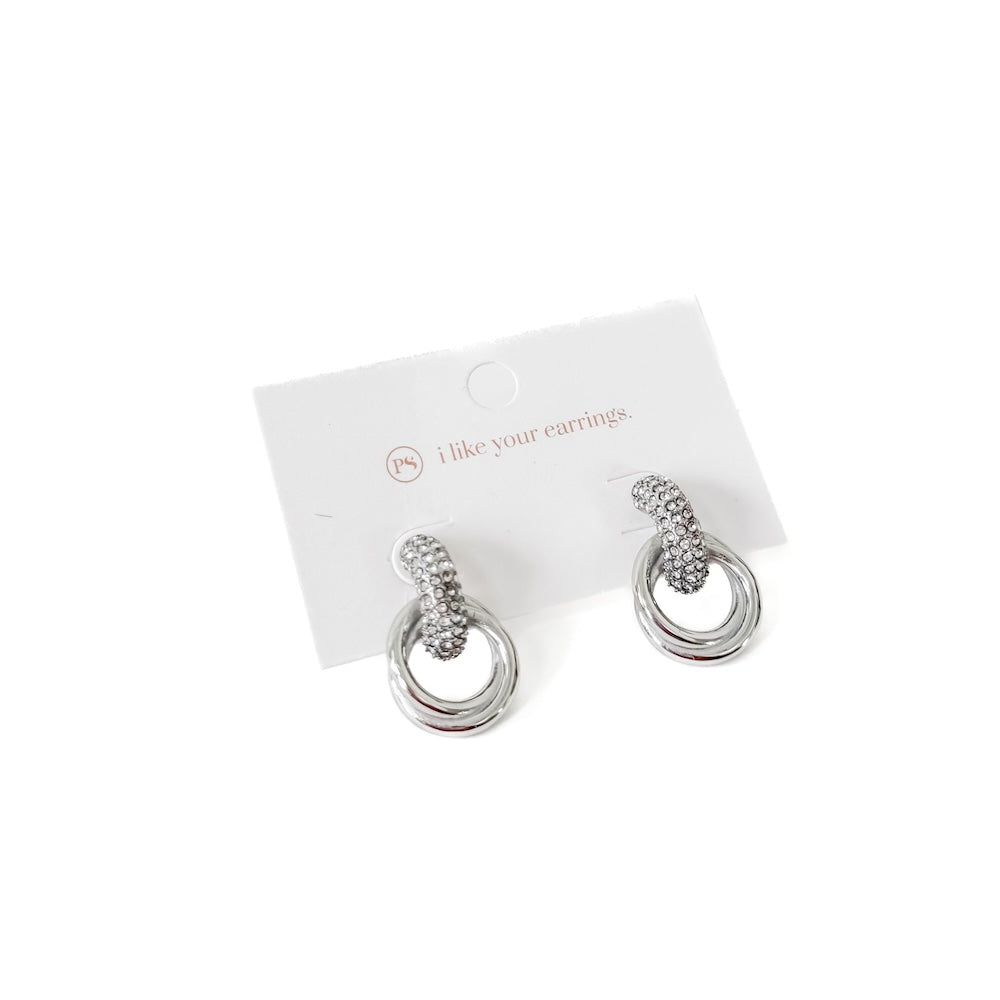Silver double hoop diamond earrings on display card