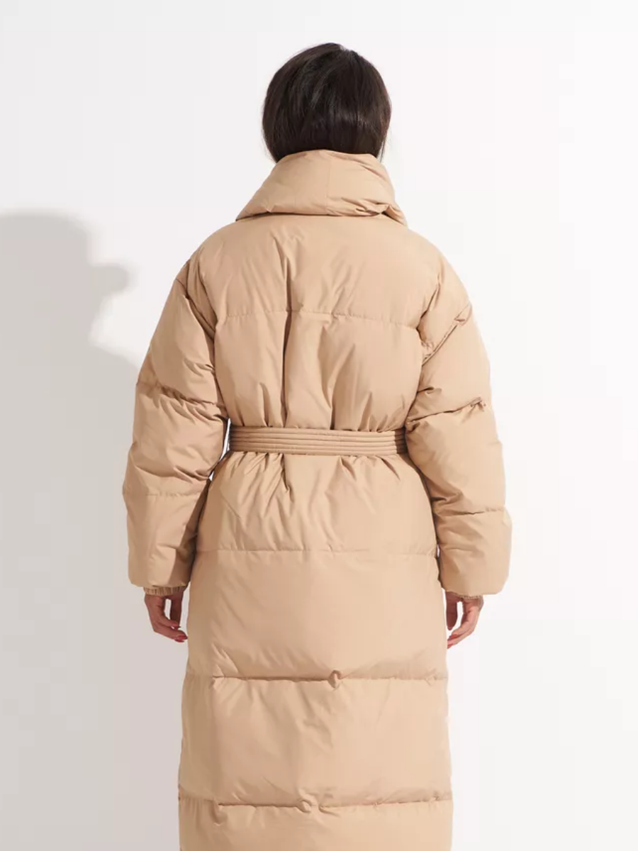 Back view of the long caramel down coat with a belted waist