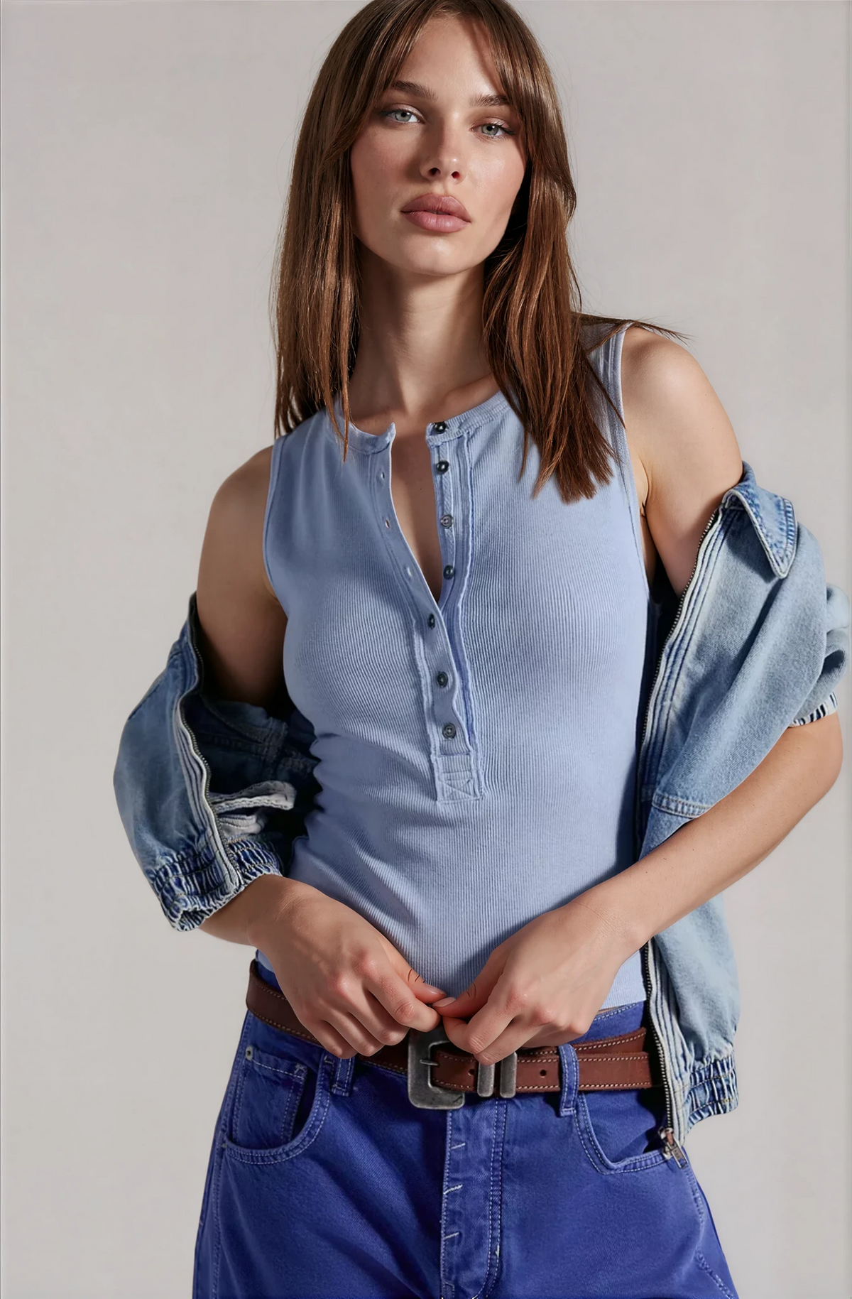 Blue henley tank top with button placket and sleeveless scoop neckline