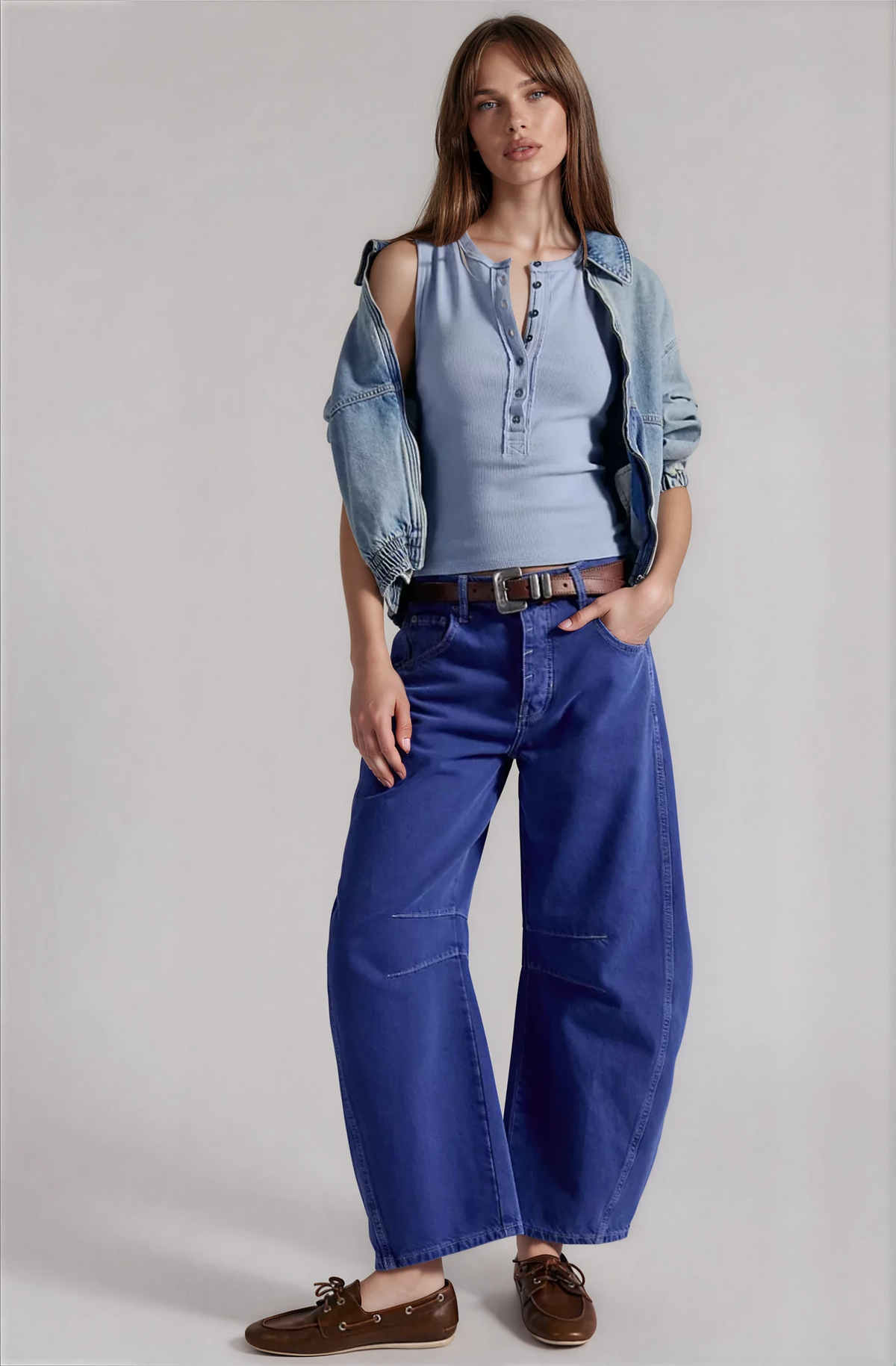 Light blue henley tank top with buttons and cropped length, worn with jeans