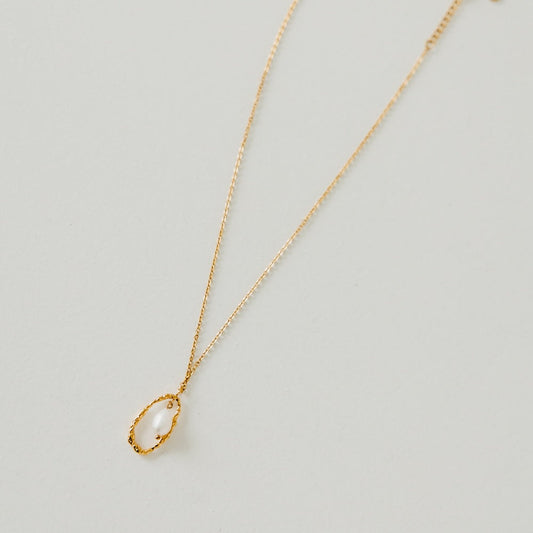 Gold-tone necklace with teardrop open-circle pearl pendant