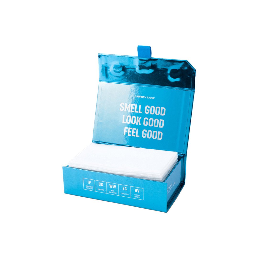 Luxury scented dryer sheets in a blue open box with white sheets inside.