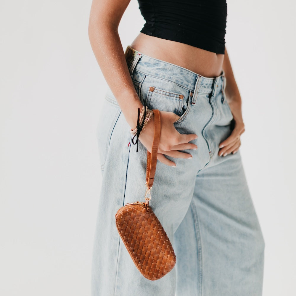 Woven sunglass case wristlet in warm brown with long wrist strap and zipper