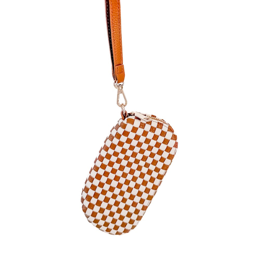 Woven checkered sunglass case wristlet in brown and white with tan strap