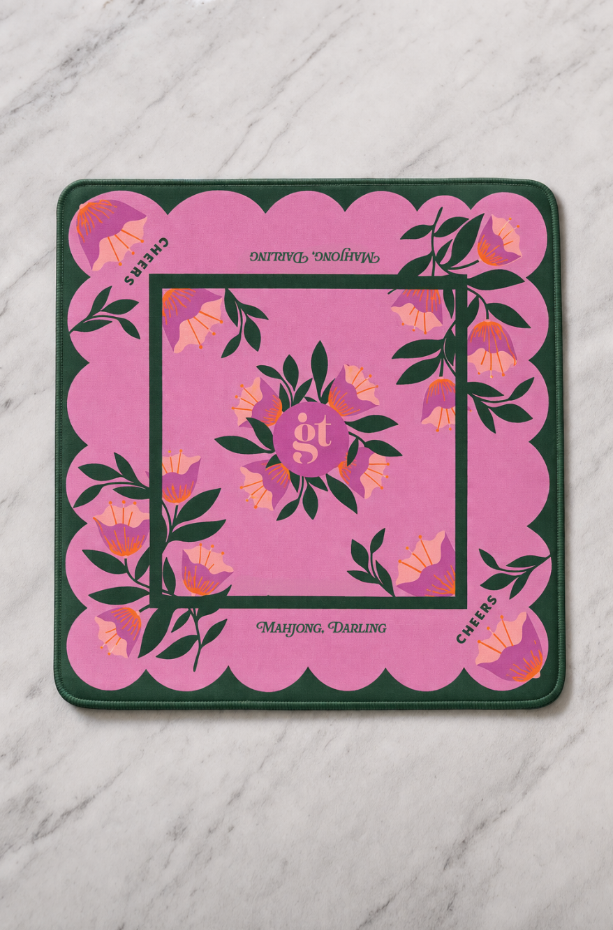 Square mahjong mat with pink center floral medallion, dark green border, scalloped edges