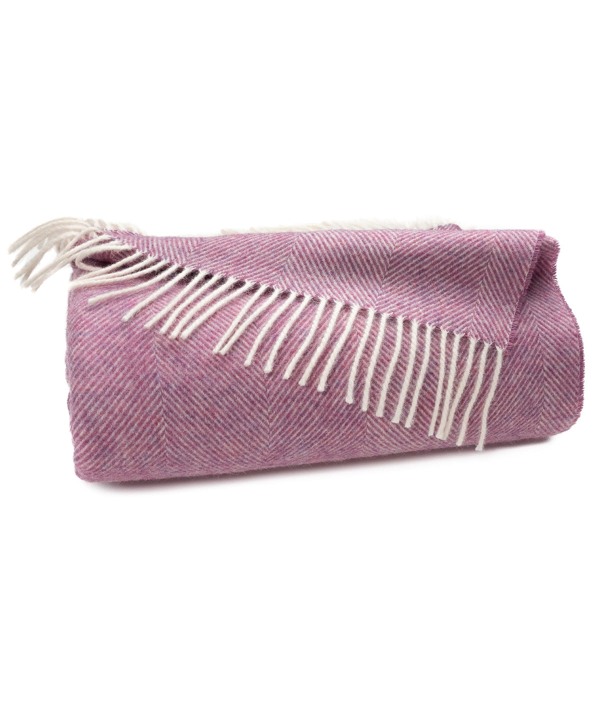 Petal pink herringbone throw blanket with cream tassels and folded corner