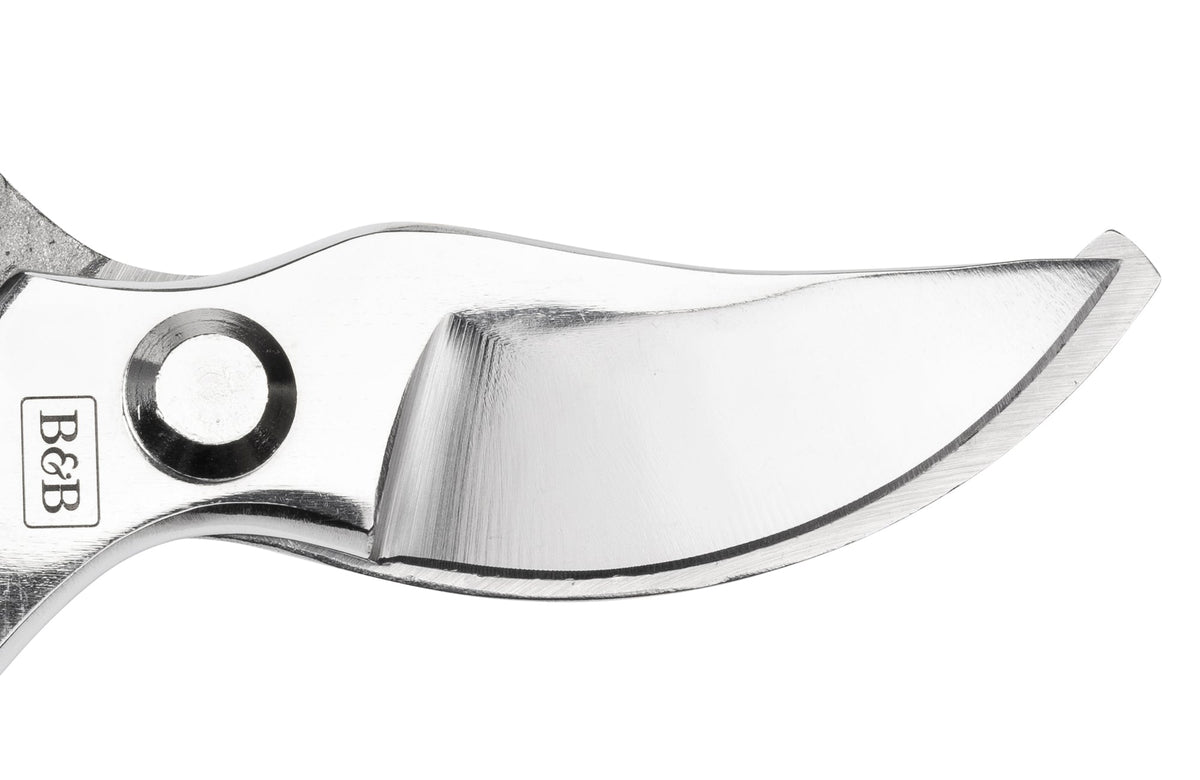 Bypass pruner blade close-up with sharp curved cutting edge and B&B stamp