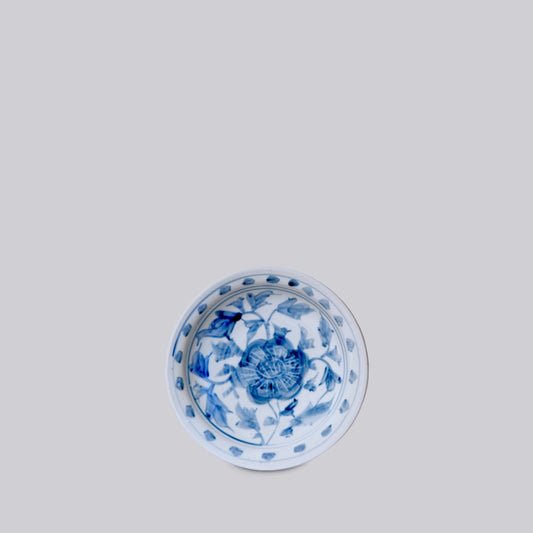Small blue and white porcelain peony dish, round top view with blue floral pattern