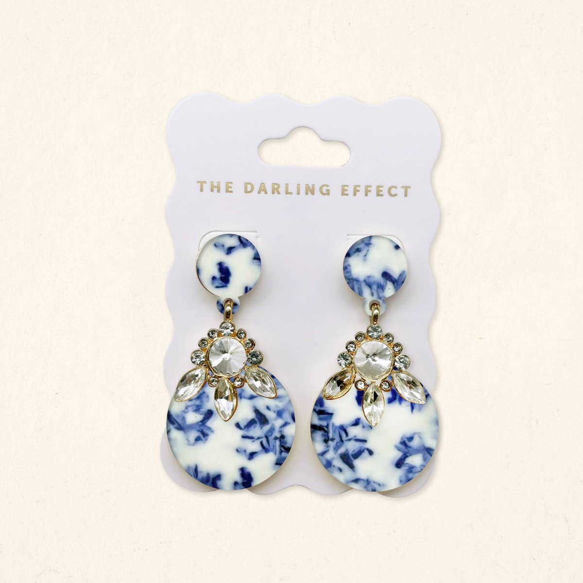 Earrings in blue-and-white with rhinestone cluster and gold-tone dangling charms