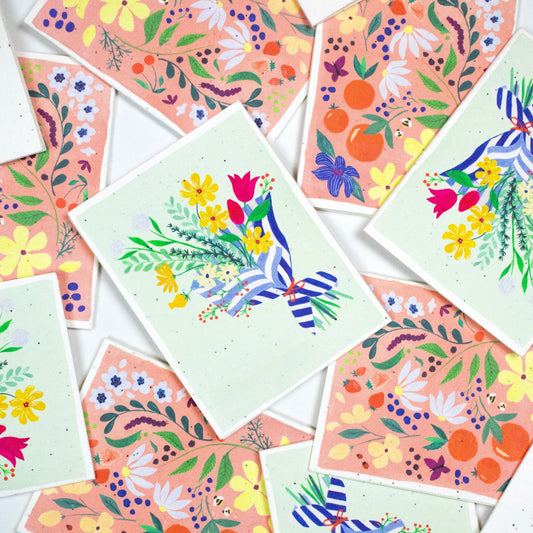 Set of floral seed cards with colorful illustrated botanicals and blue-striped ribbon accents