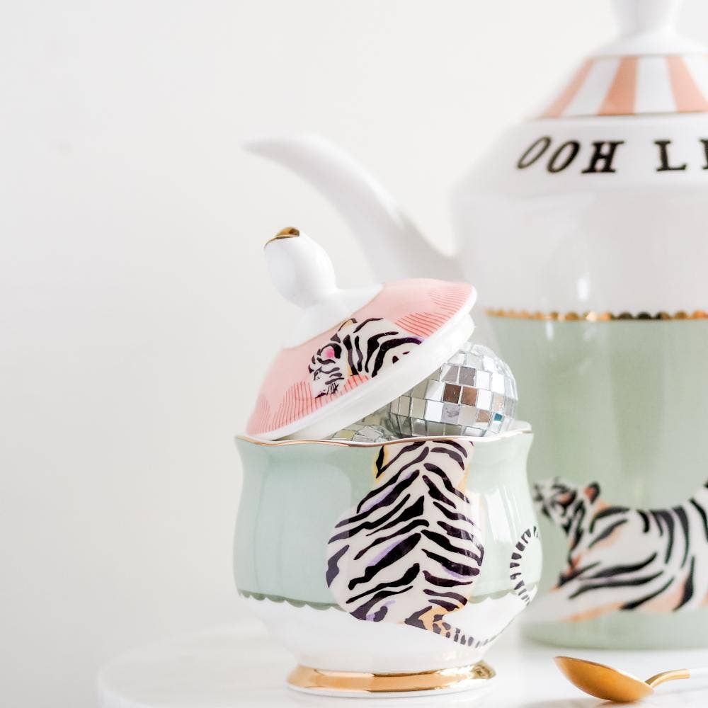 Tiger-print sugar bowl with mint base and gold-trimmed lid finial