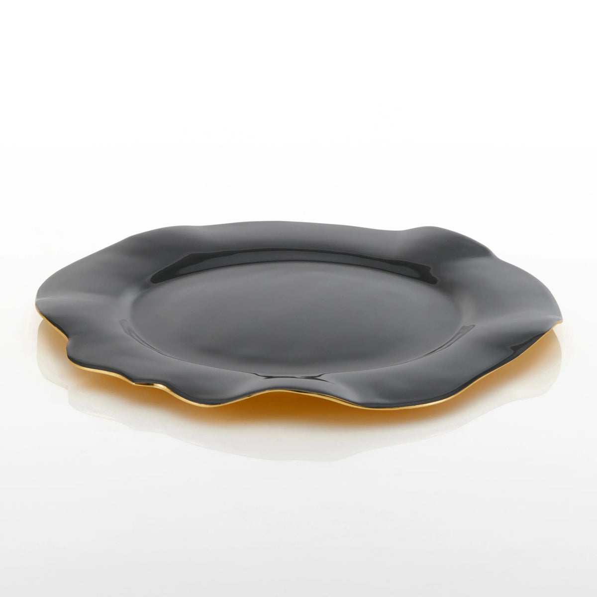 Graphite ruffled serving plate, glossy dark finish with gold trim around edge