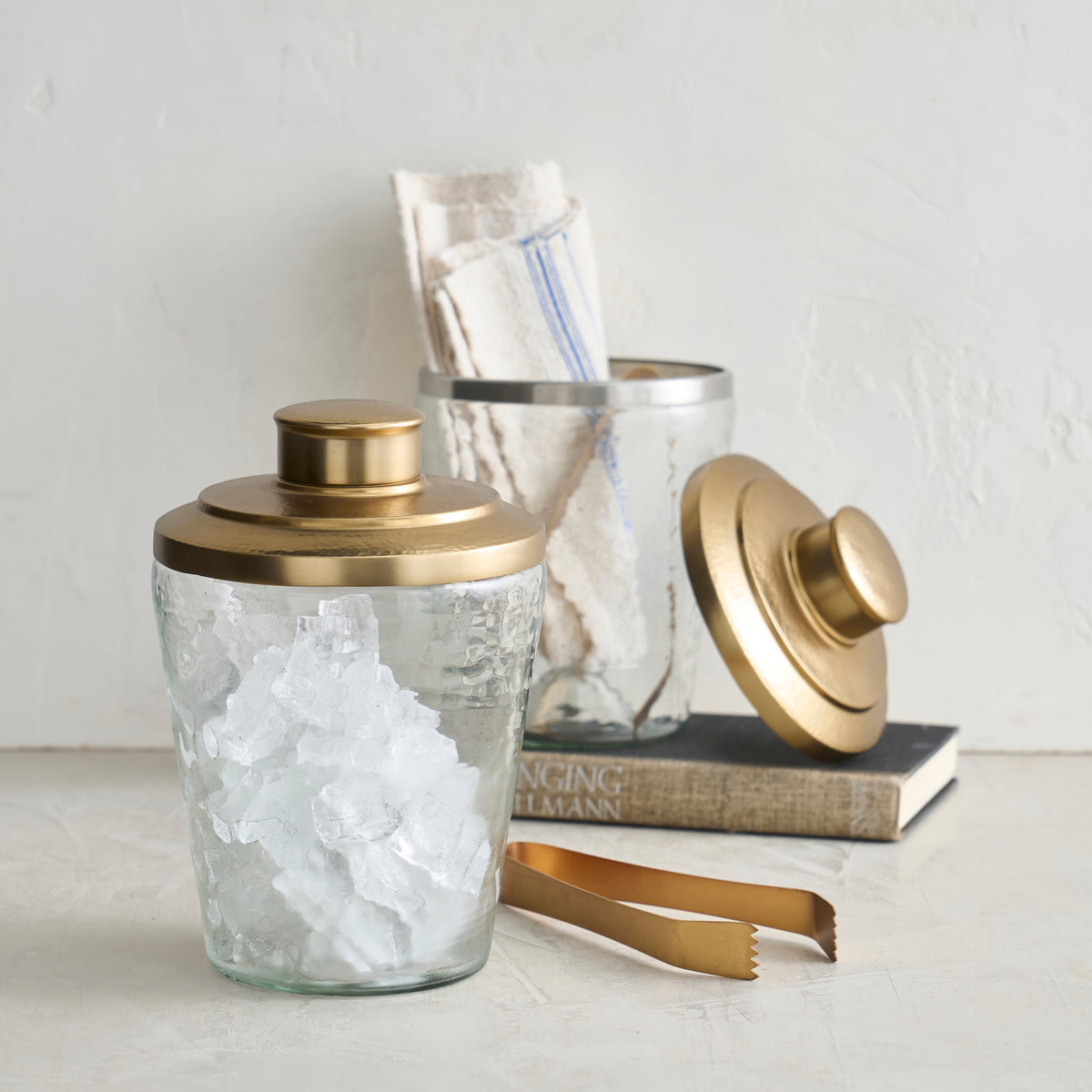 Pebbled ice bucket with lid and matching gold-tone tongs, clear glass with ice texture