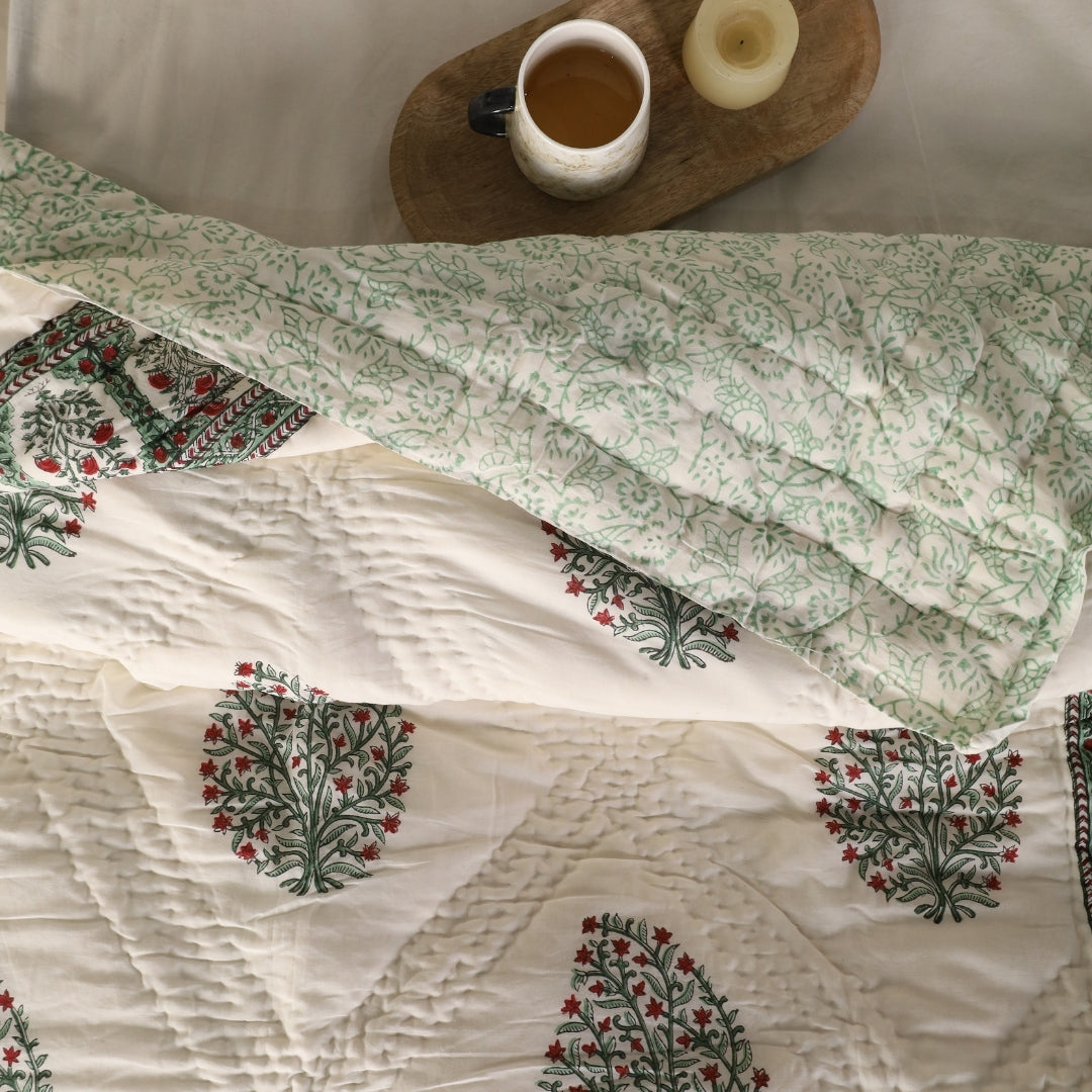 Reversible quilt with mint green blockprinted florals on white with red accents