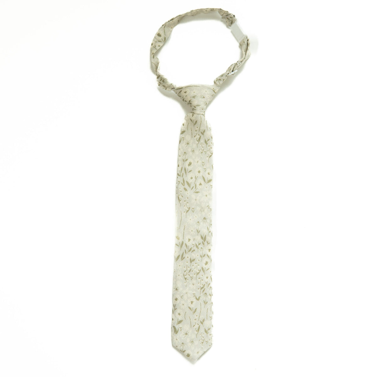 Boys tie in light fabric with small floral print, slim necktie design.
