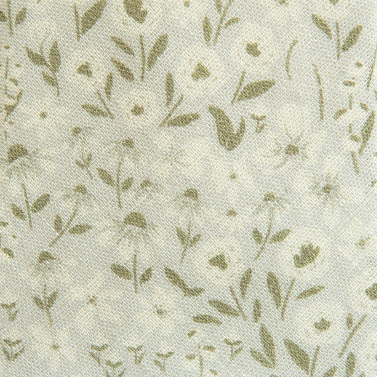 Close-up cream hair sash fabric with small green floral sprig pattern