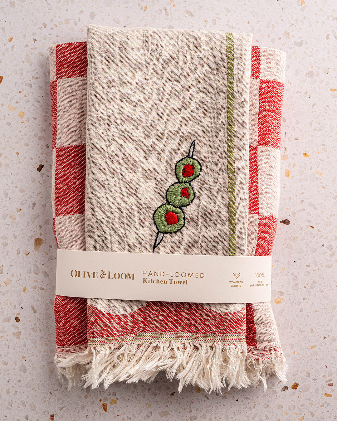 Kitchen towel set with cream fabric, red plaid border, and green olive embroidery