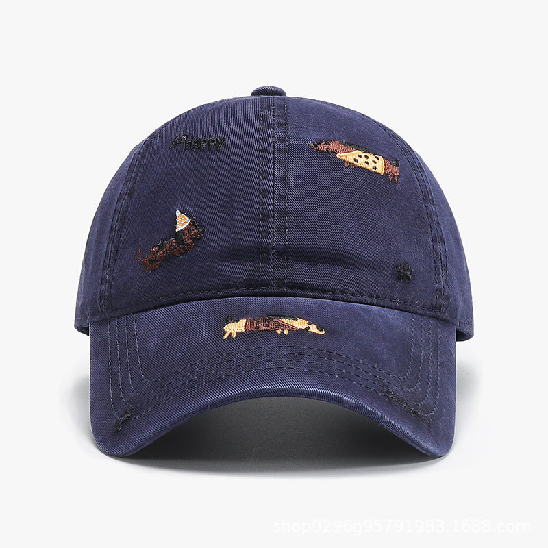 Navy blue baseball cap with curved brim and embroidered animal motifs