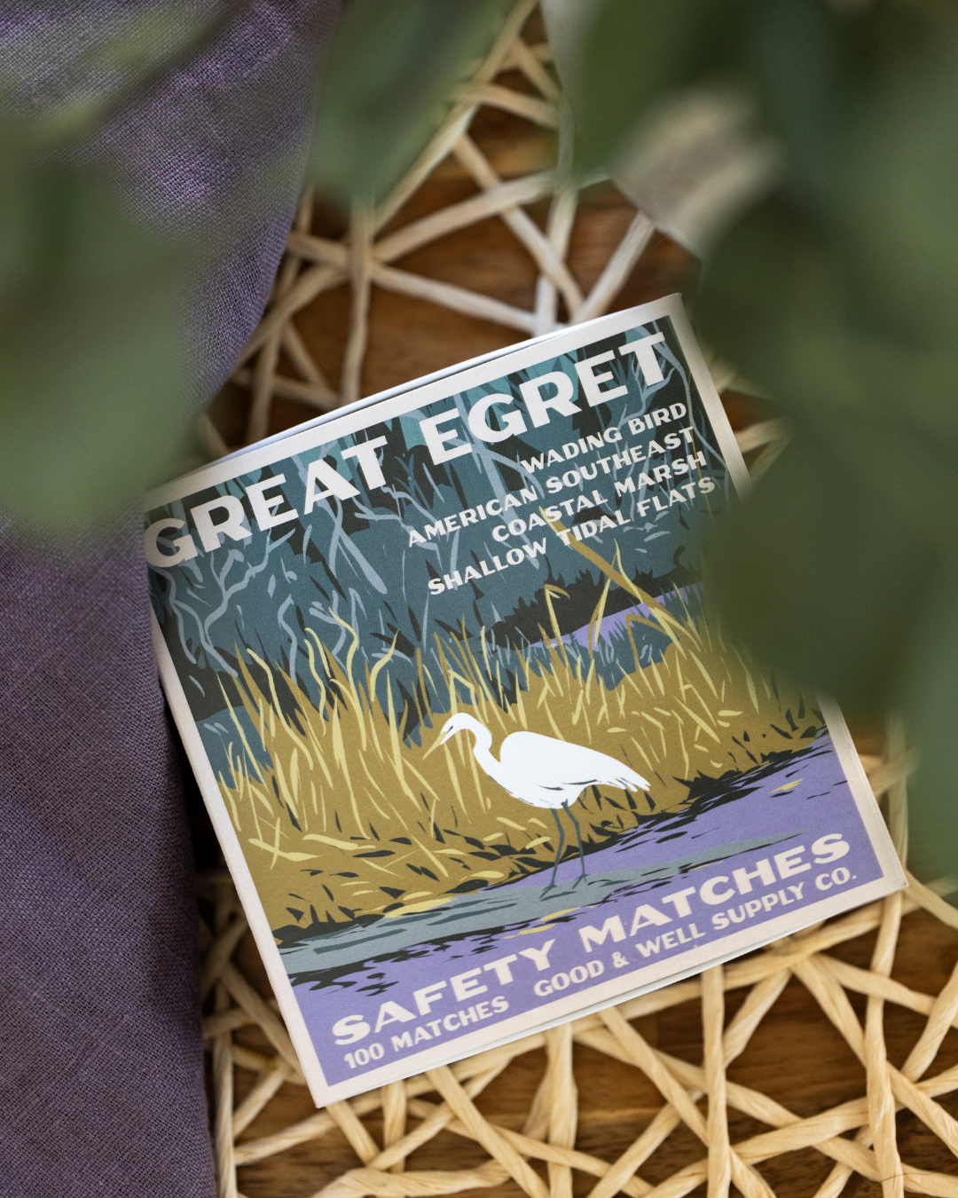 Great Egret safety matchbox with illustrated bird and marsh habitat text