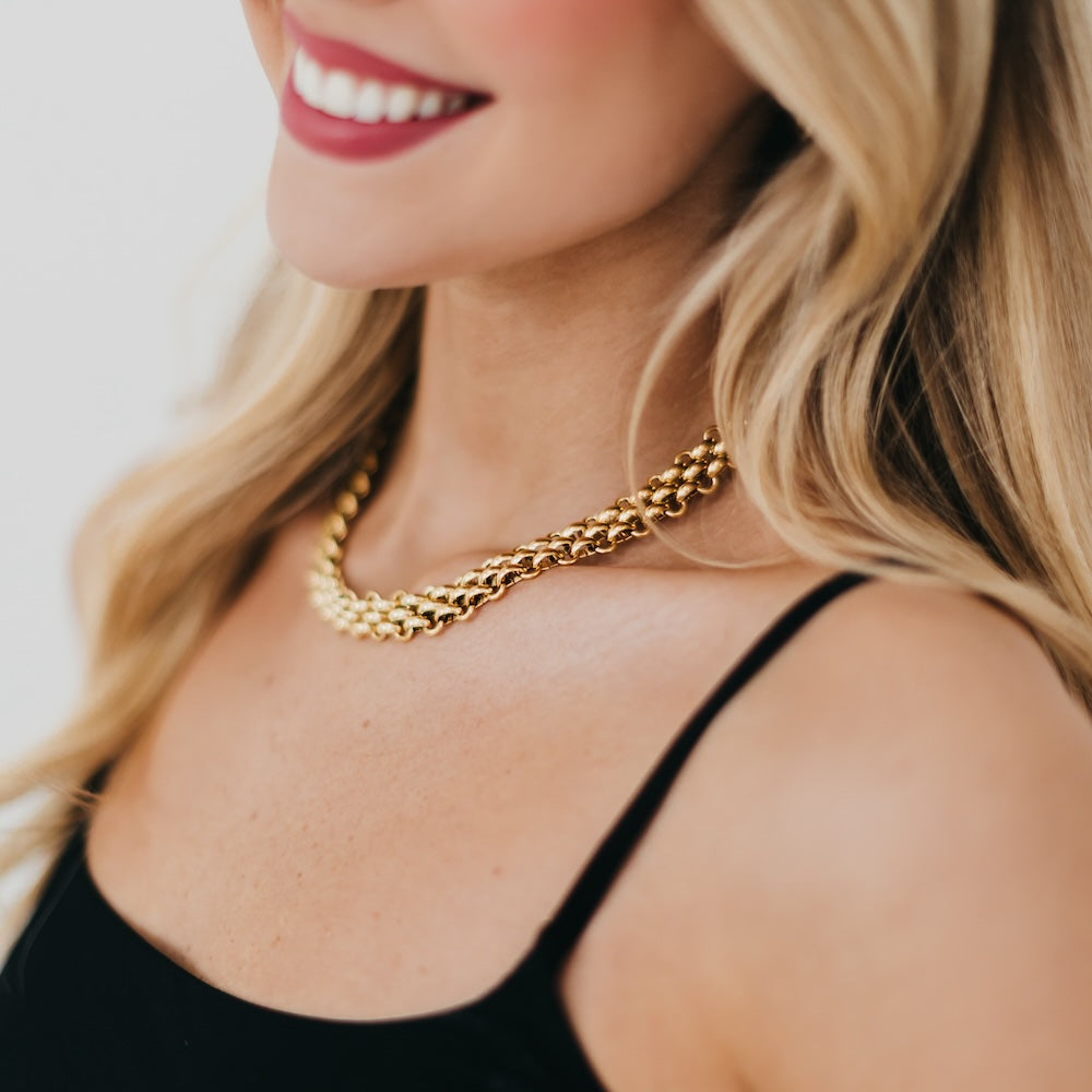 Elise woven chain necklace with gold-tone links, close-fitting on neckline