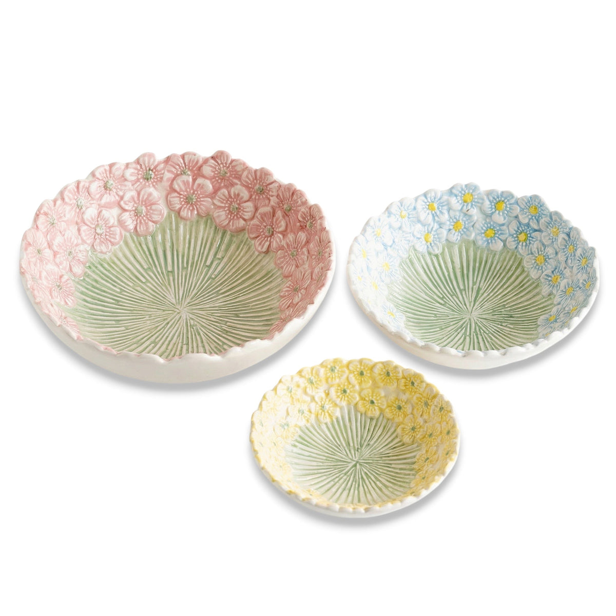 Embossed daisy ceramic bowls set, pink, blue, and yellow with ridged green fan center