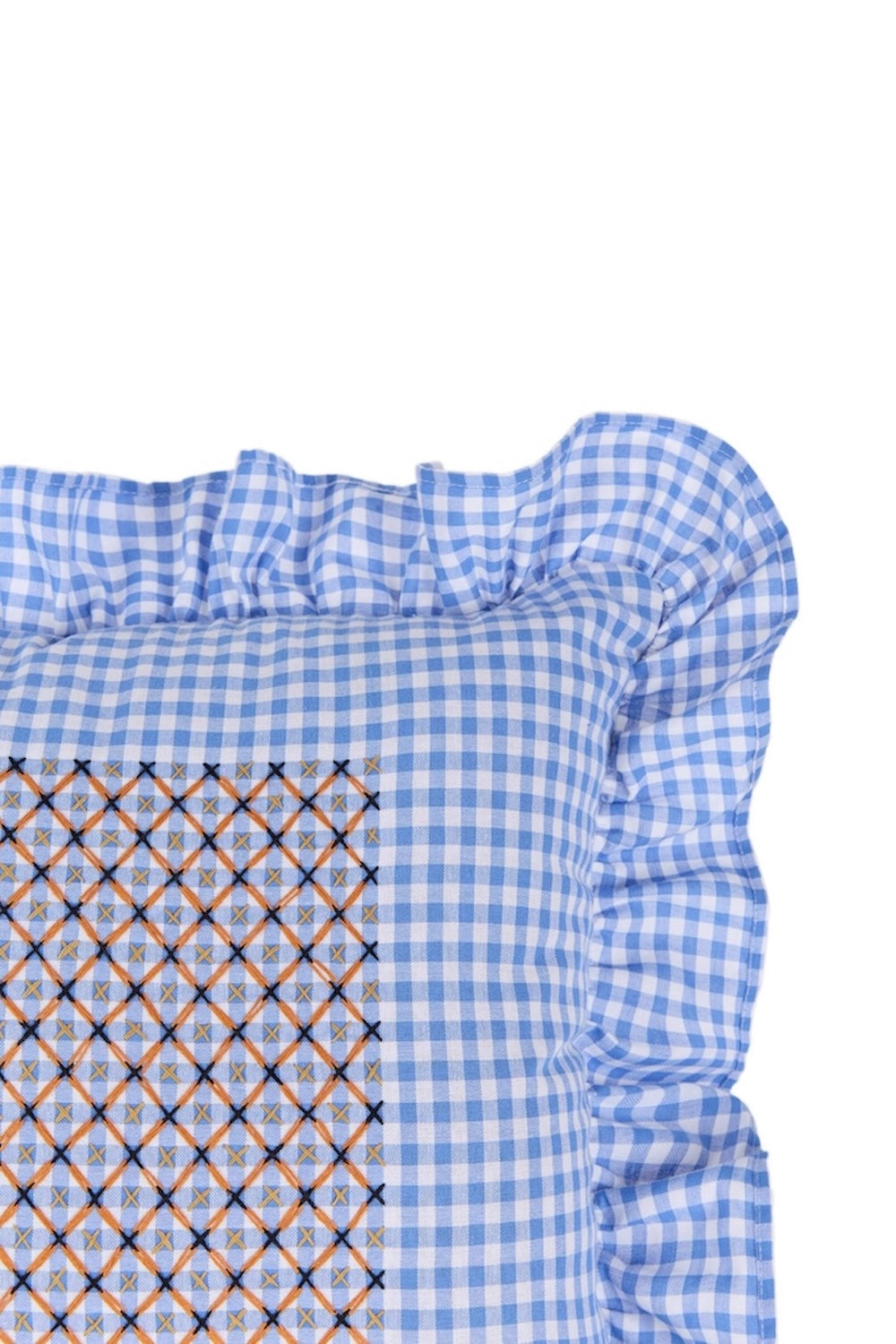 Blue gingham cushion corner with gathered ruffle trim and stitched diamond panel