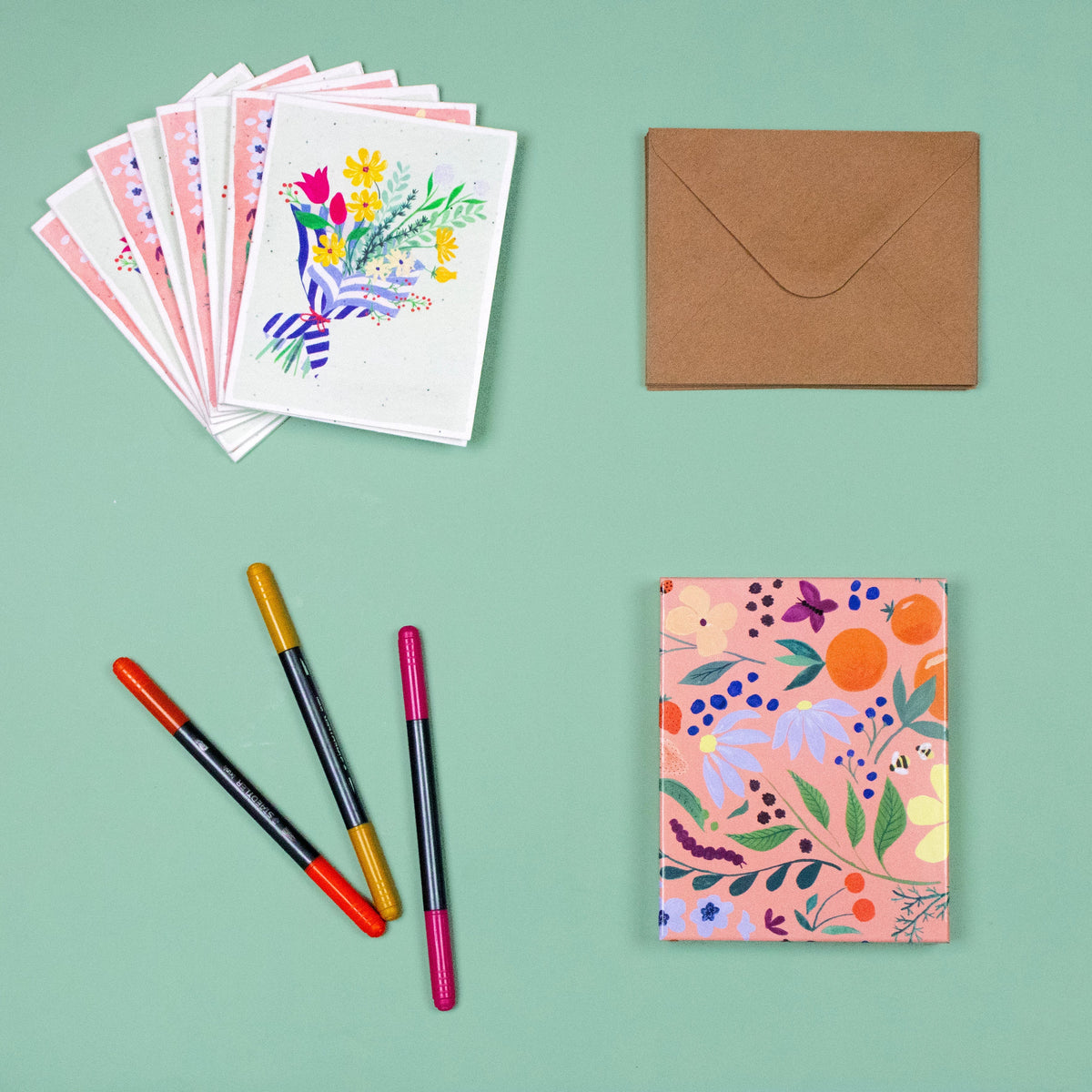 Floral seed cards pack with brown envelope, shown with colorful botanical designs