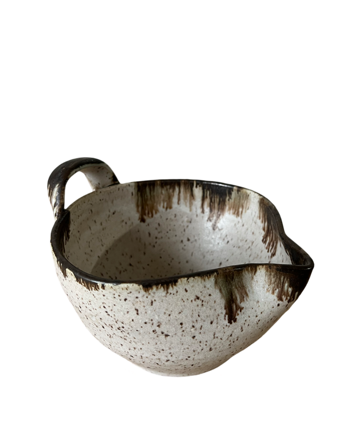 White stoneware batter bowl with speckled brown glaze and loop handle