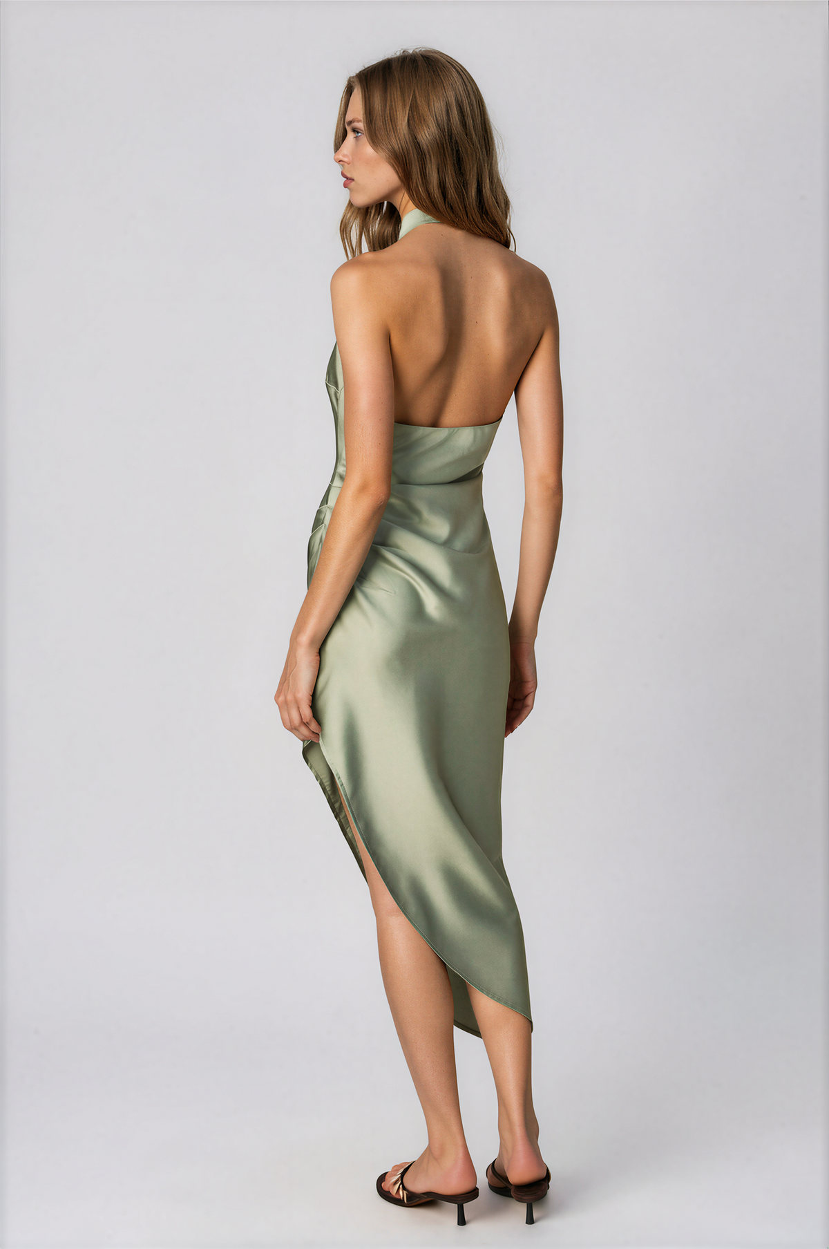Sage green halter midi dress, open back with draped detail and asymmetrical hem