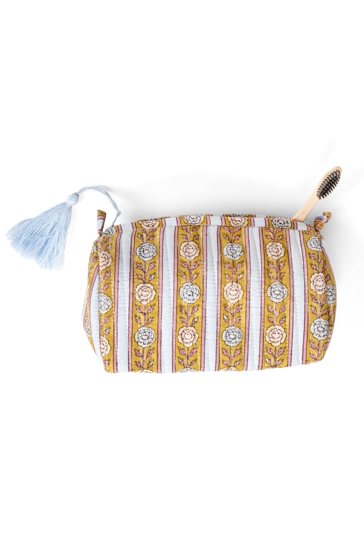 Striped makeup bag with tassel trim and zip top in gold tones