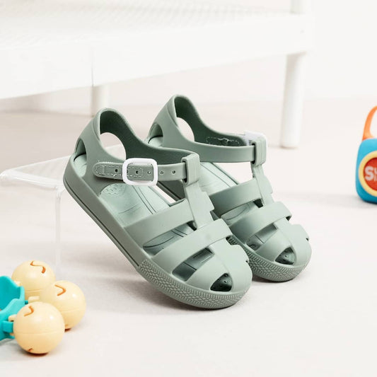 Kids' fisherman jelly sandals in light green with adjustable side straps and buckle