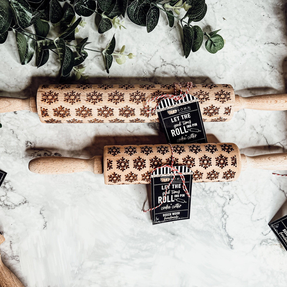 Wooden Christmas rolling pin with snowflake border pattern and winter icons