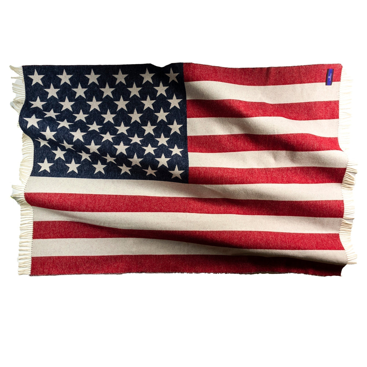 American flag throw laid flat, star field on left and stripes across the right, fringed borders