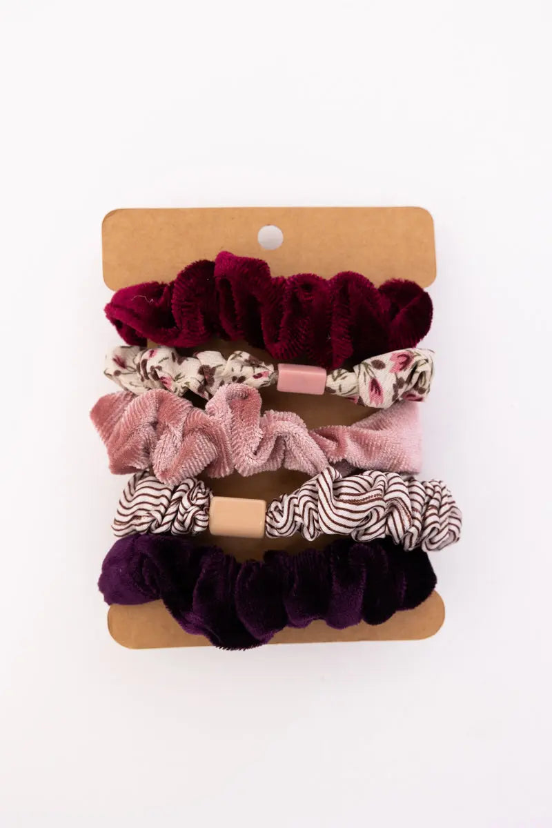 Assorted autumn floral hair scrunchies on card: burgundy, pink, purple, and patterned