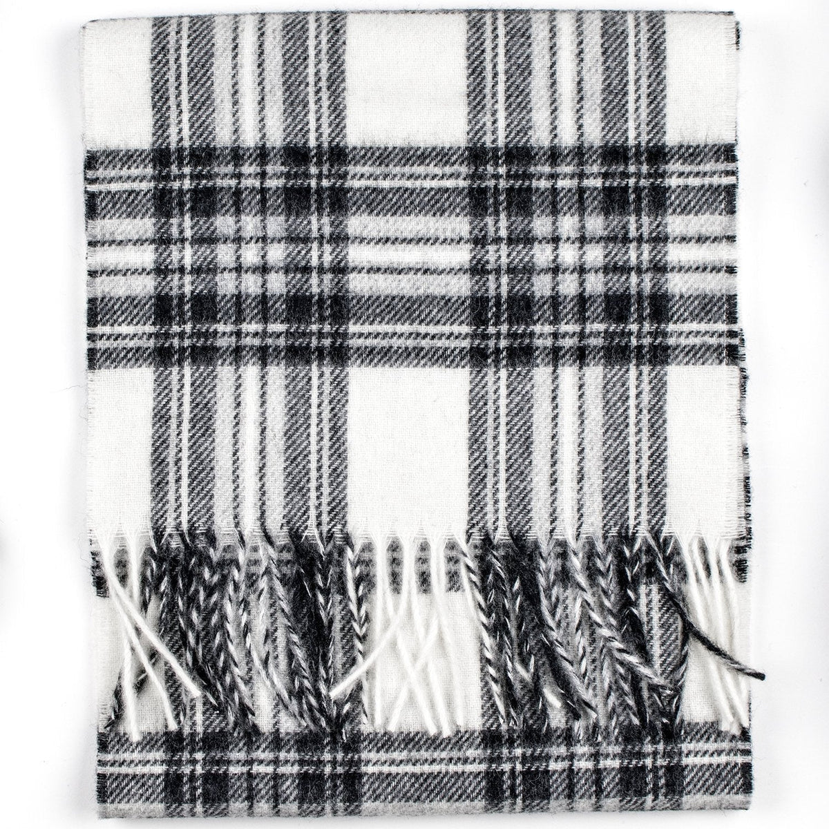 Merino lambswool tartan scarf laid flat with grey and black plaid and tassel fringe